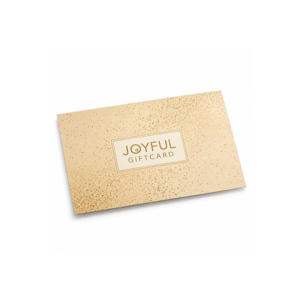 Vaaleanruskea, suorakulmainen Joyful-lahjakortti, jossa on kultahiutaleita sisältävä kuvio; kortin sisällä on teksti JOYFUL GIFT CARD kultaisella reunuksella varustetun suorakulmion sisällä.